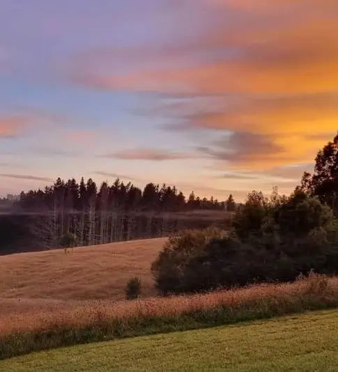 Rolling green hills at sunset near Keystone Lodge.