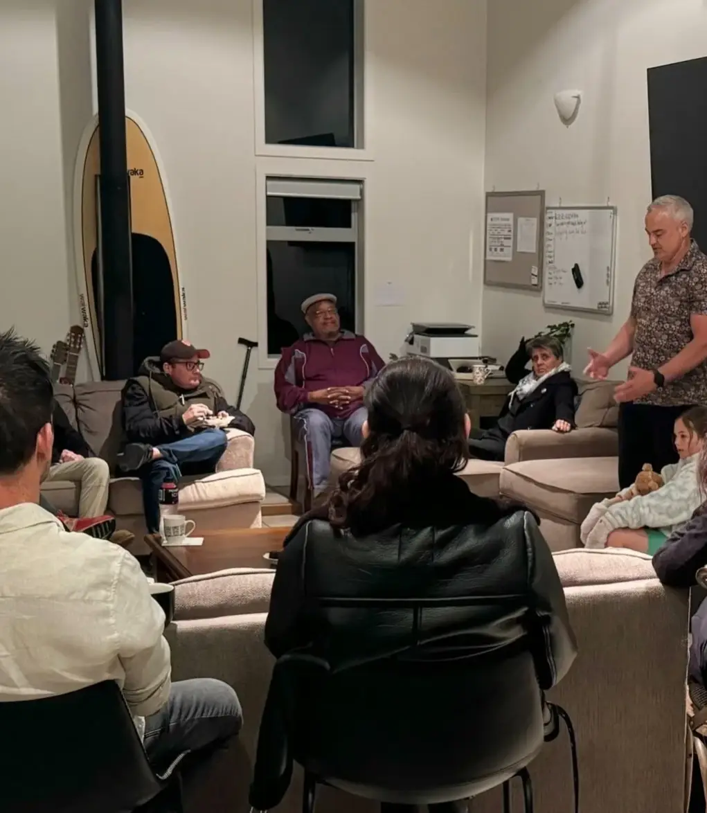 Guests and recovery mentors talking together in the Keystone Lodge living room