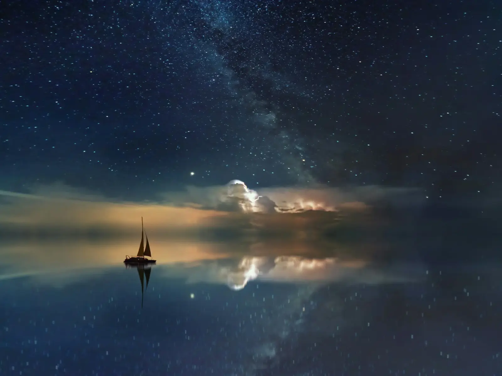 A boat on calm water with light breaking through storm clouds.